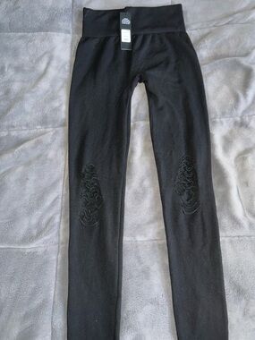 Black High-Waist Women's Leggings with knees cutout.